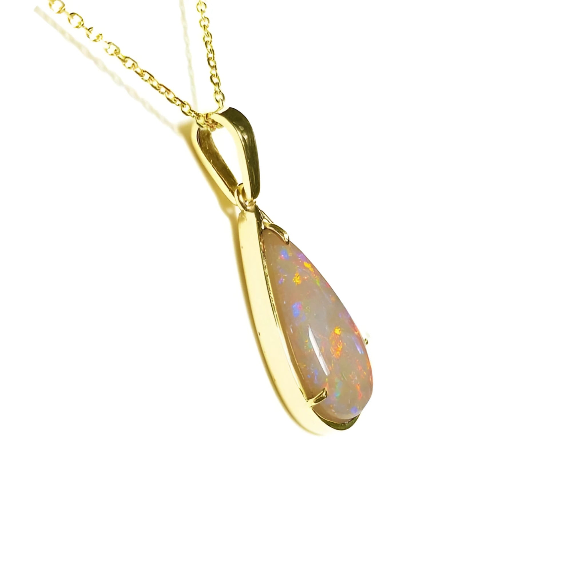 Pear-shaped Australian opal pendant with fiery red/orange hues in 14k yellow gold setting on a chain.