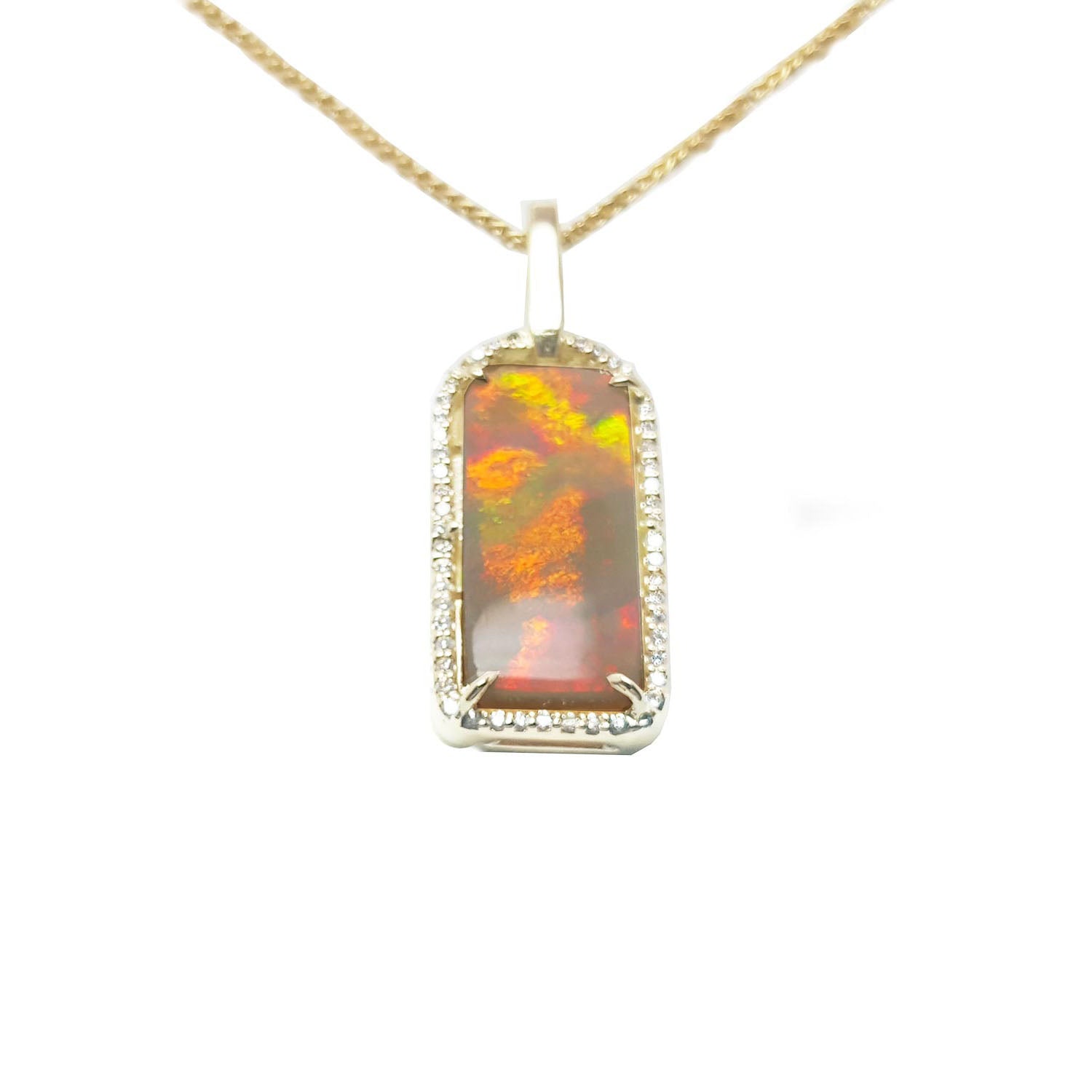 A red-orange fire natural Australian opal pendant necklace on a gold chain displaying its topside profile.
