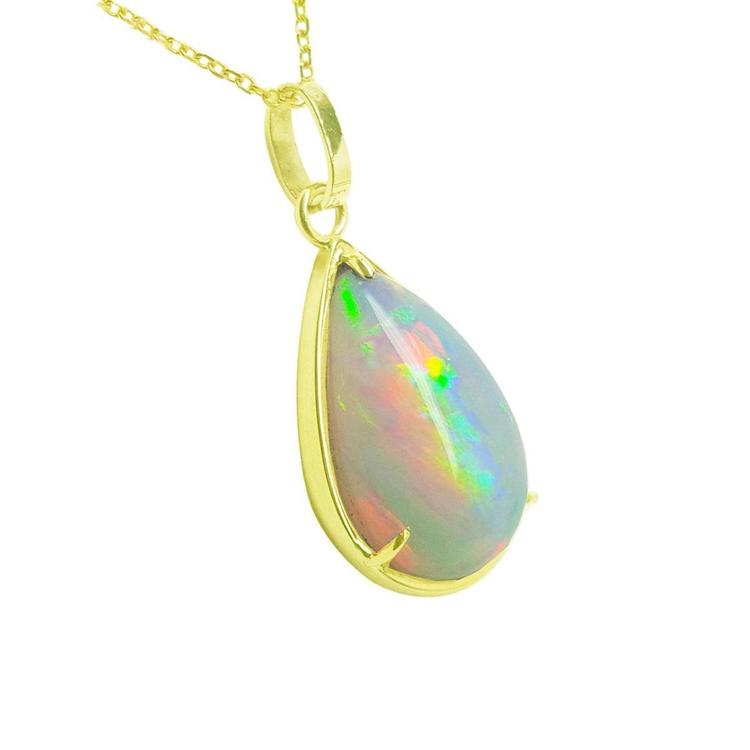 Radiant 9.29 ct. Ethiopian opal teardrop pendant in 14K solid yellow gold, displaying a full spectrum of colors.