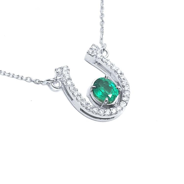 Horseshoe emerald necklace for women crafted in 14k white gold, a lucky piece of jewelry to wear every day