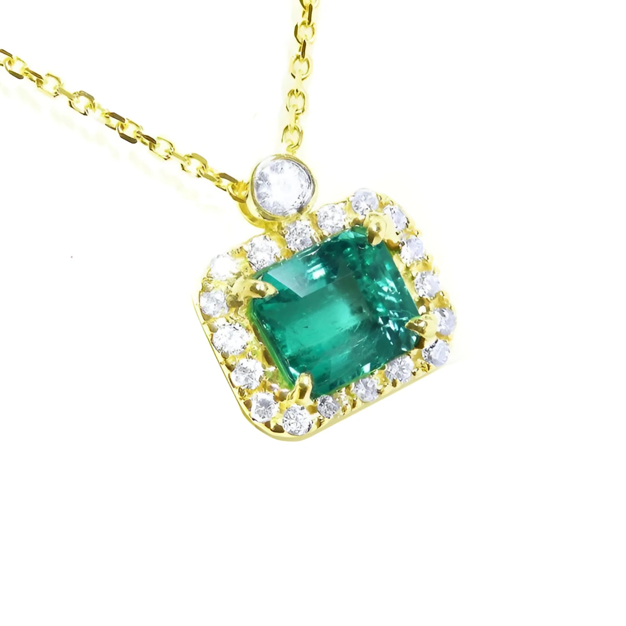 Emerald necklace east west orientation encircled in a halo of natural diamonds, crafted in 14k yellow gold