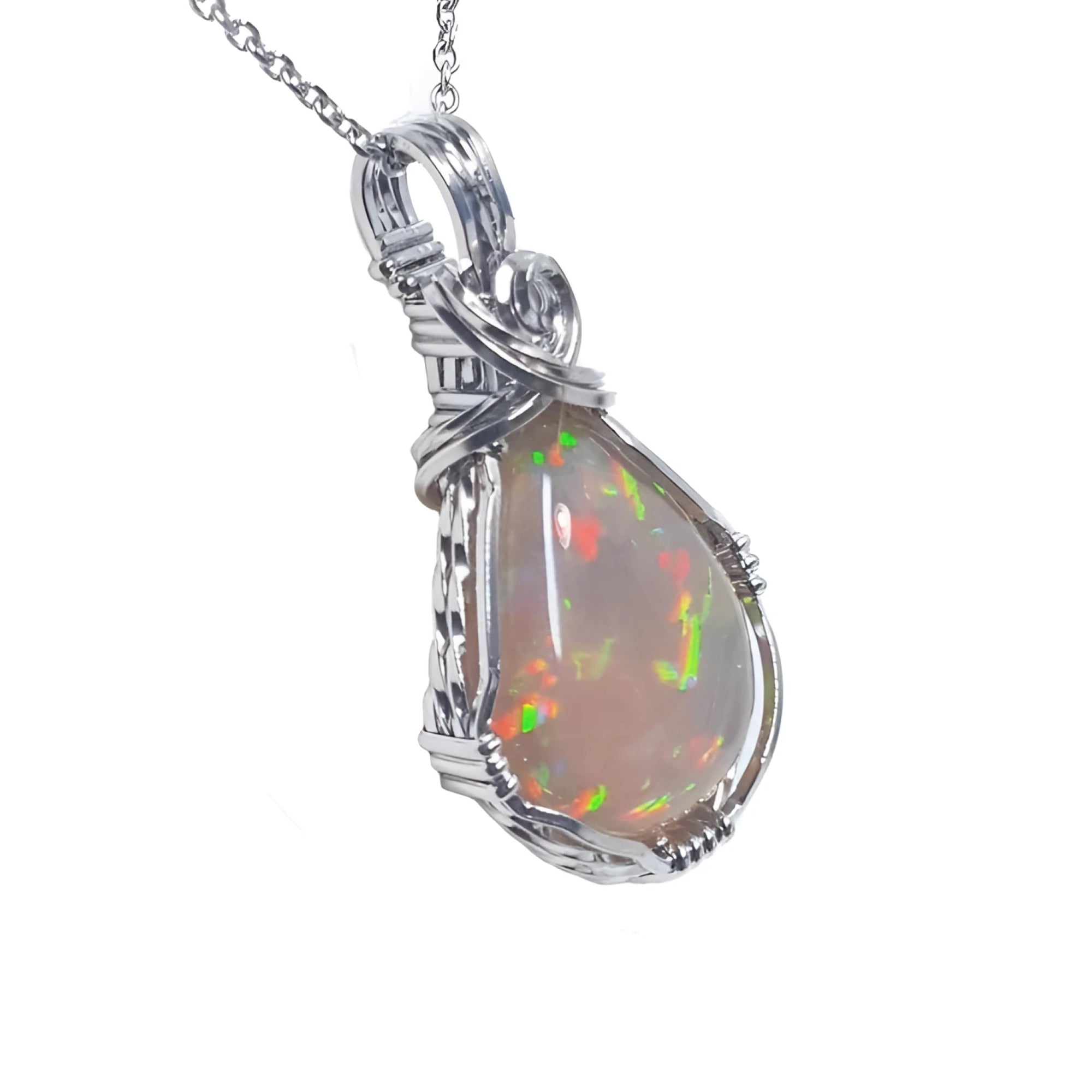 Welo Ethiopian multicolor opal pendant with pinpoint colors, wrapped in handmade silver wire.