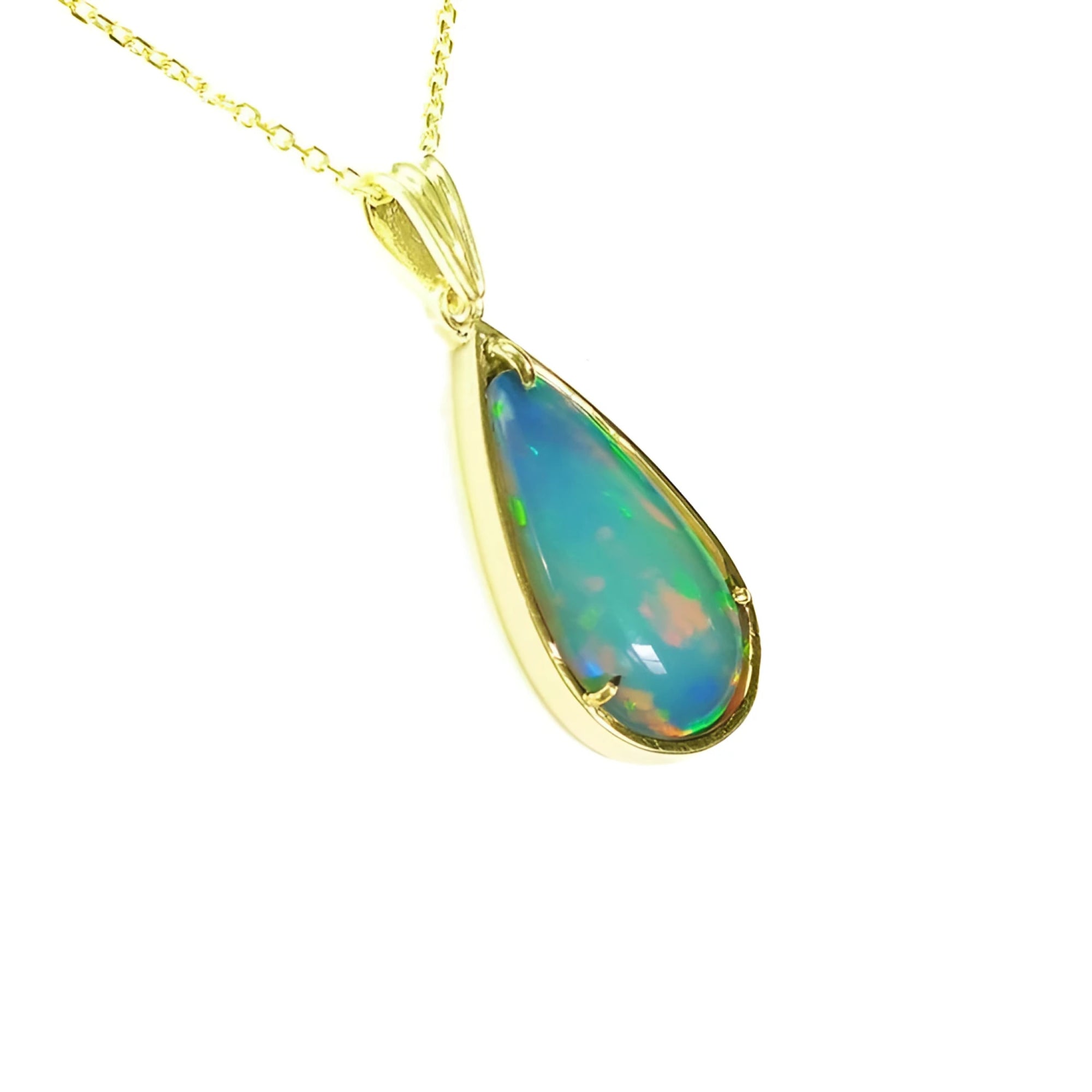 Ethiopian opal pear pendant with blue-violet play-of-color in 14K yellow gold.