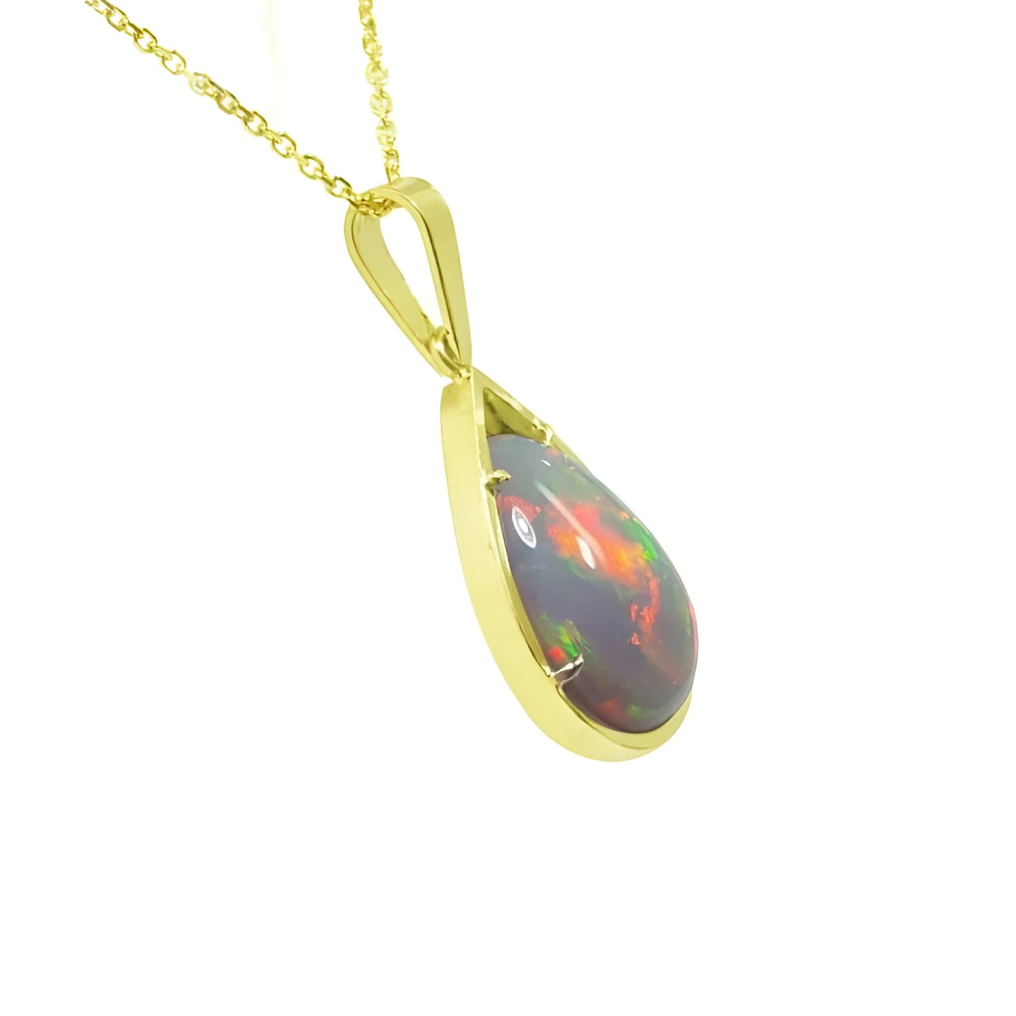 Pear-shaped Ethiopian Welo opal pendant with fiery red-orange play of color, set in 14K yellow gold.