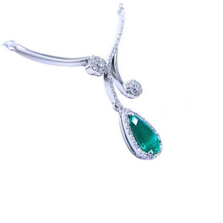 White gold necklace with a teardrop natural Colombian emerald pendant on a halo diamond.