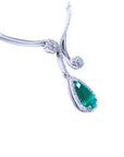 White gold necklace with a teardrop natural Colombian emerald pendant on a white background