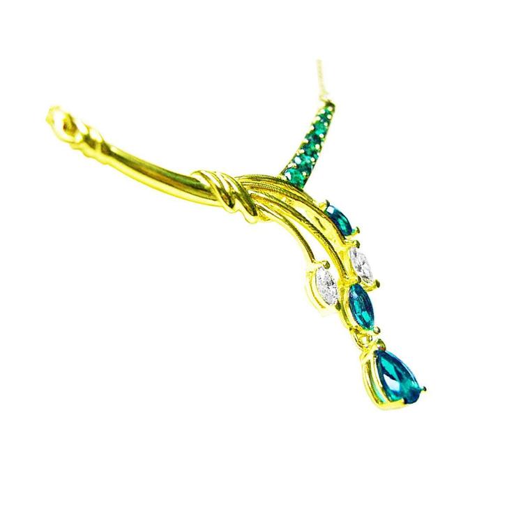 A 14k yellow gold necklace blended pear shaped marquises and round cut  colombian emeralds.