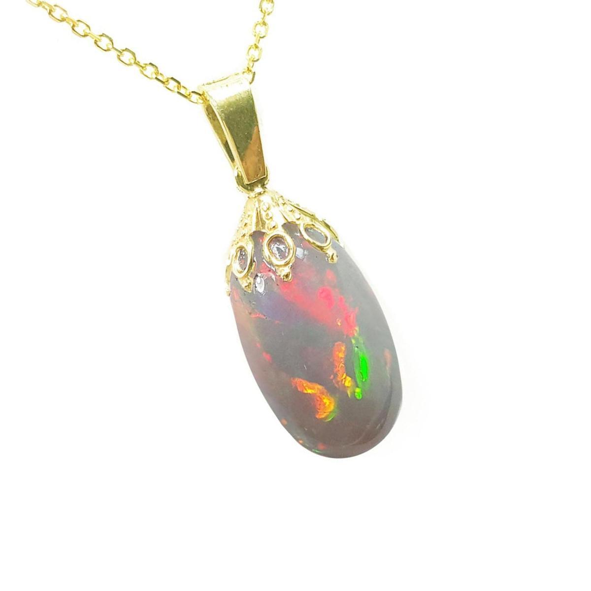 Opal pendant with gold chain on a white background