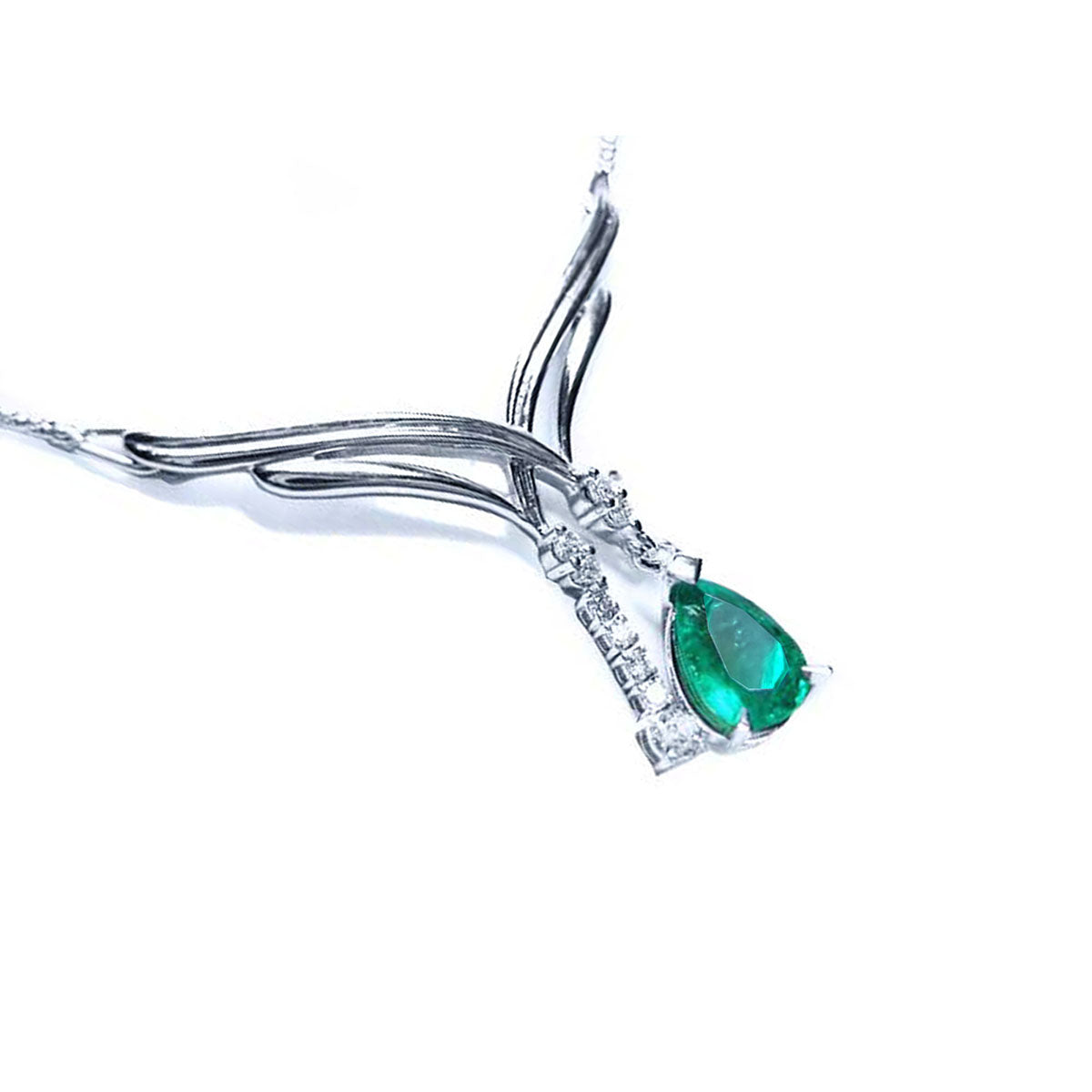 Right-view of a 14k white gold emerald necklace natural pear cut sparkling medium green color