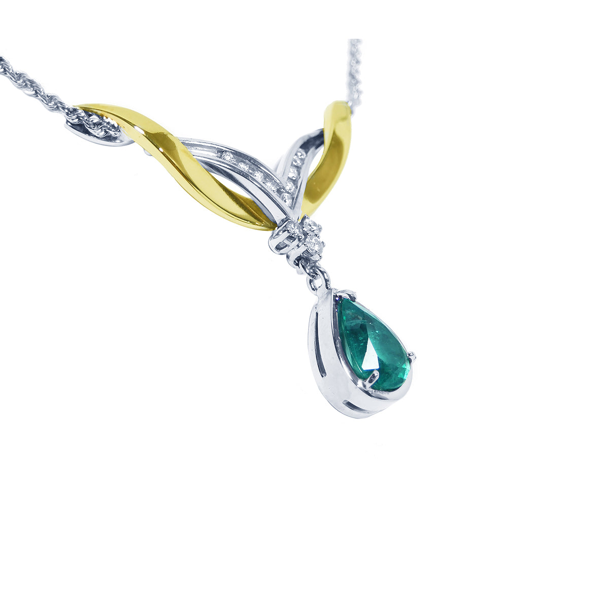 Right side view of a lady's natural teardrop emerald necklace crafted in 14k white and yellow gold 