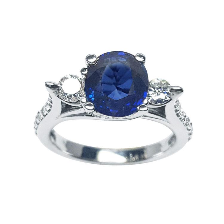 Women's natural blue sapphire ring side diamonds three stone white gold, half tall top view