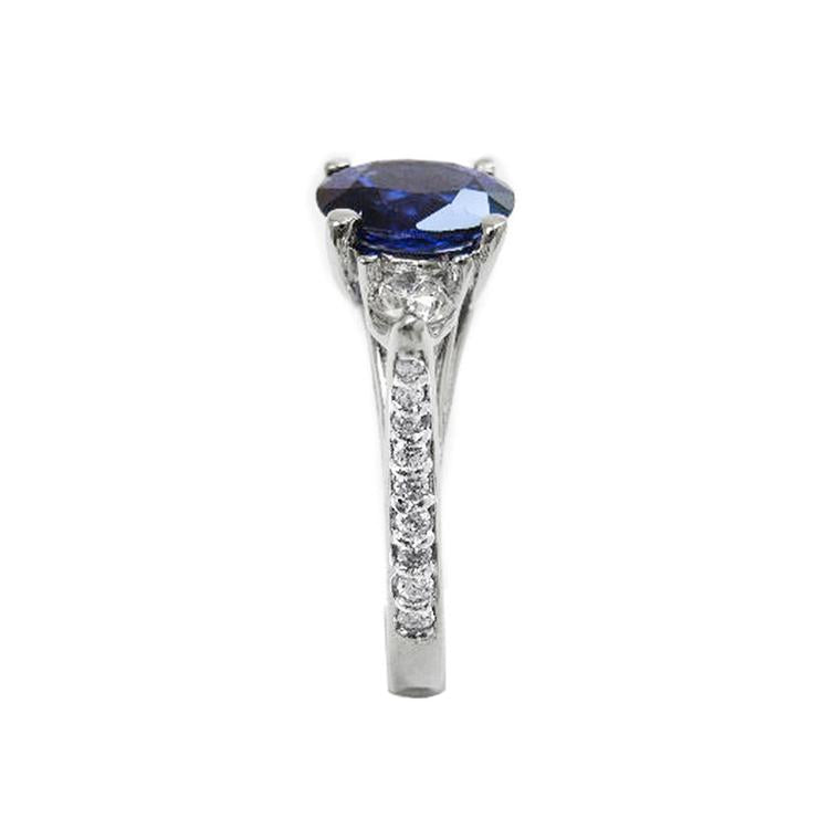 Women's natural blue sapphire ring side diamonds three stone white gold, side top shank profile view