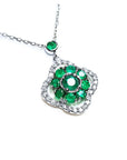 A natural emeralds necklace cluster set within a delicate 4-leaf clover design, crafted in 14k white gold and diamonds.