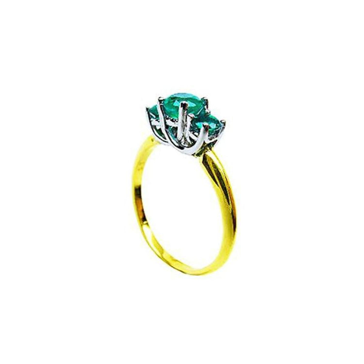 Round cut three-stone emerald ring with a yellow gold band and white gold prong setting.