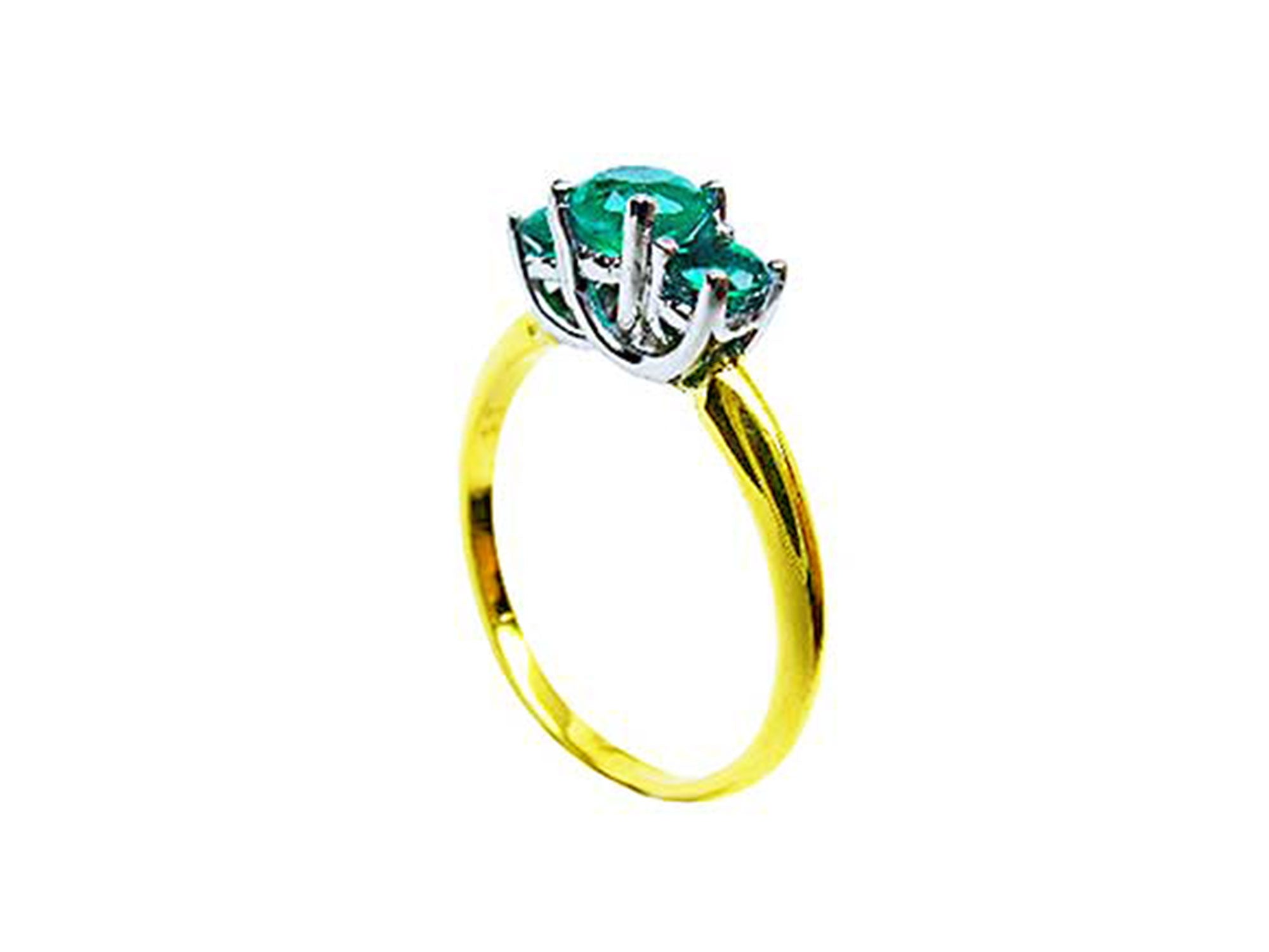 From a partial side angle, this emerald ring reveals the top setting, a portion of the gallery, and the band design.