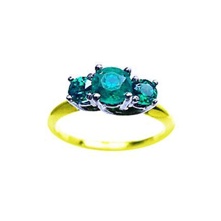 A three stone emerald ring with round cut emeralds, May's birthstone, featuring a combination of white and yellow gold.