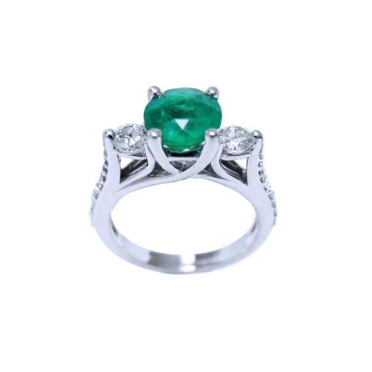 1.38 ct. round emerald ring with two side diamonds in 14K white gold.