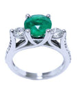 Topside profile of a round cut emerald and side diamonds, with profile gallery and band ring view.