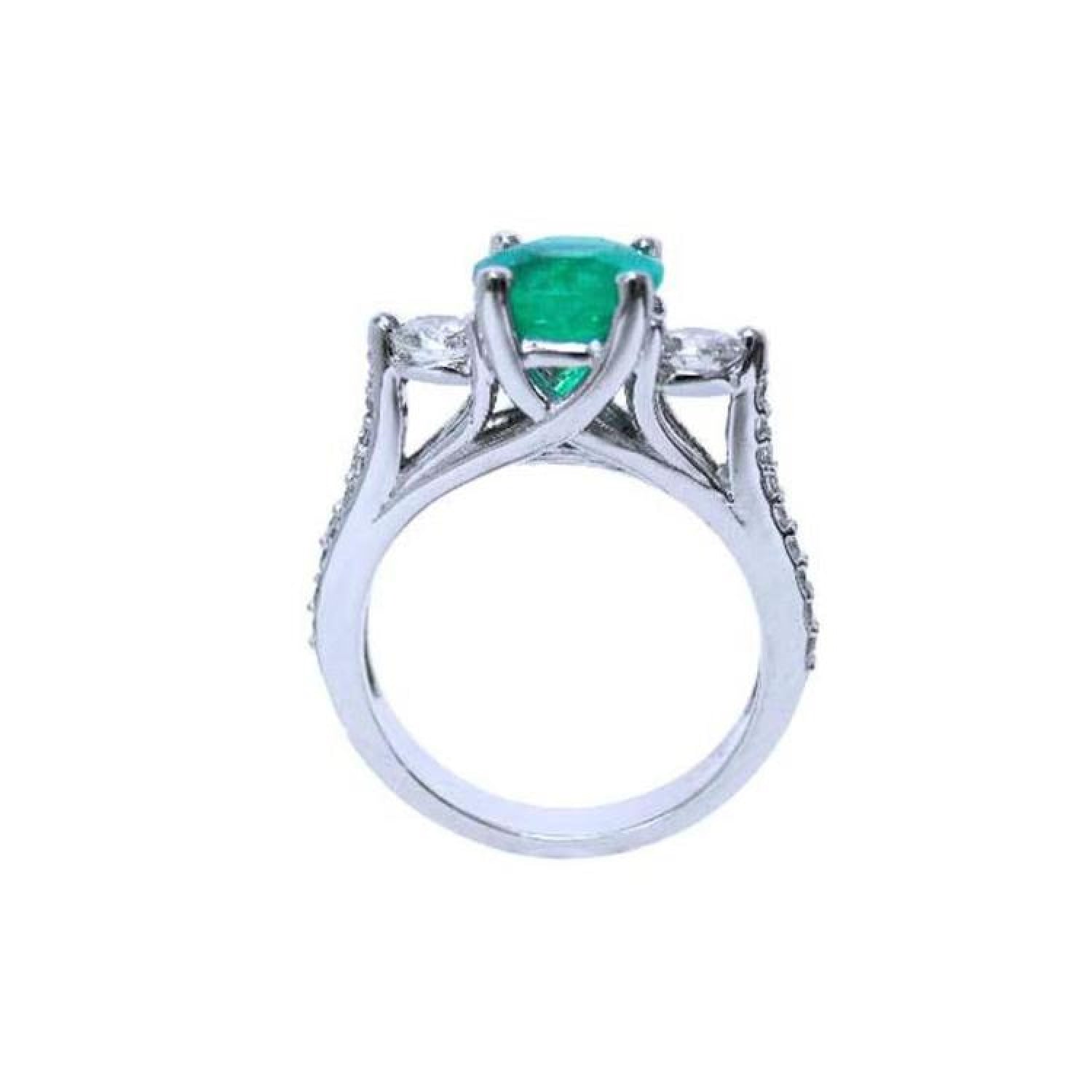1.38 ct. round emerald ring with side diamonds in 14K white gold.