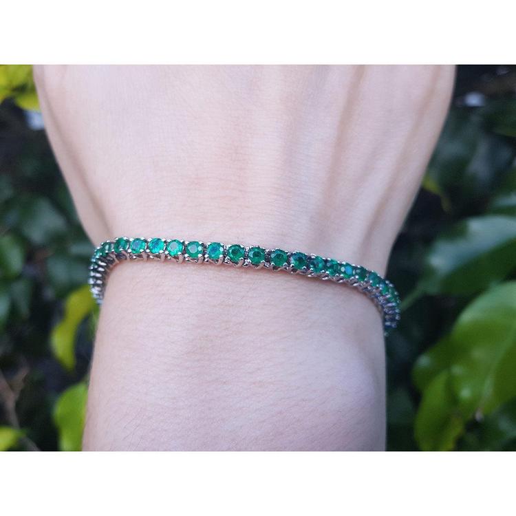 Natural Colombian Emeralds Tennis Bracelet prong set sparkling medium deep green color prong set in individual links.