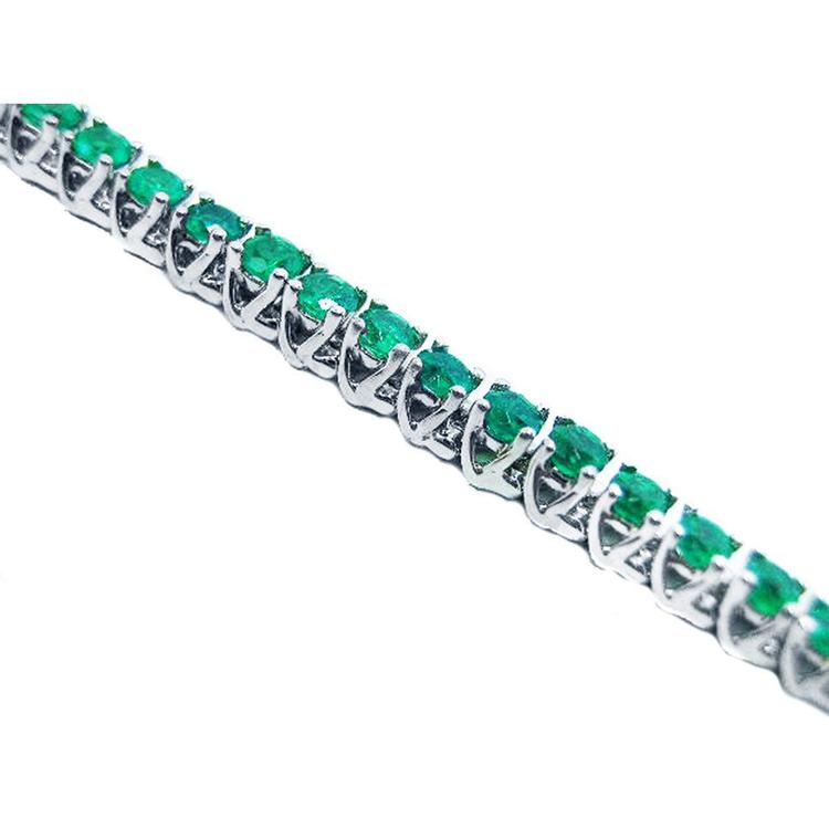 Emerald tennis bracelet round cut Muzo Colombian emeralds 14k white gold sparkling medium deep green color prong set.