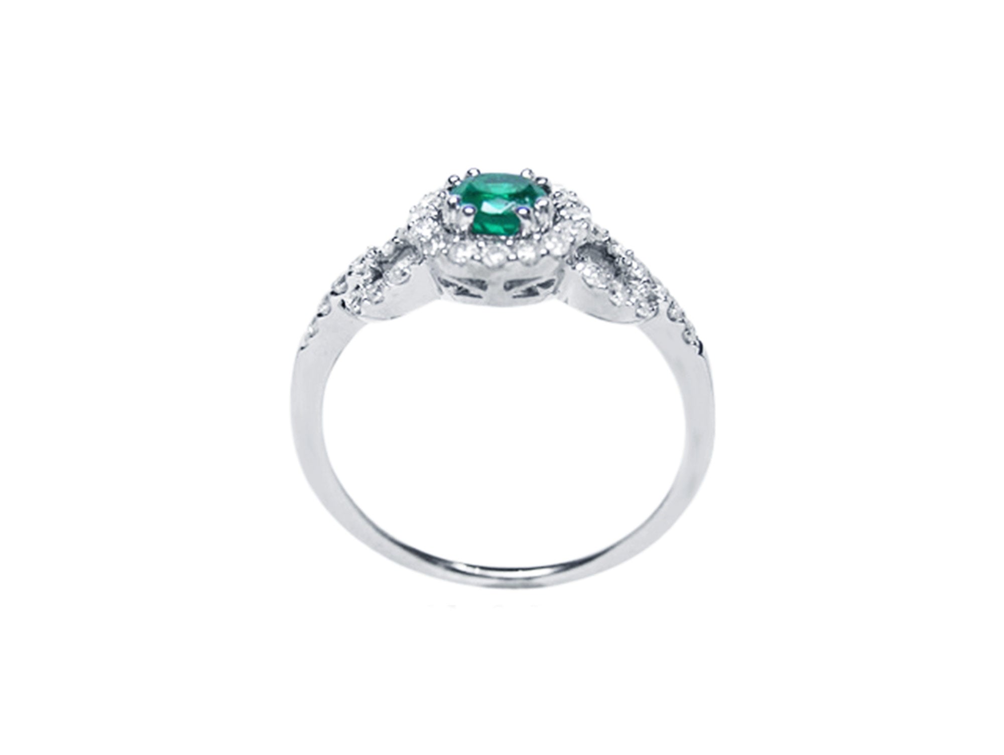A detailed view of the round cut emerald with a halo diamond ring, highlighting the top, side gallery, and band.