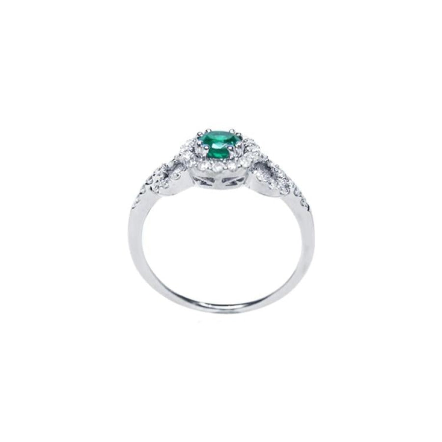 Round cut emerald halo ring with natural diamonds set in 14K white gold.
