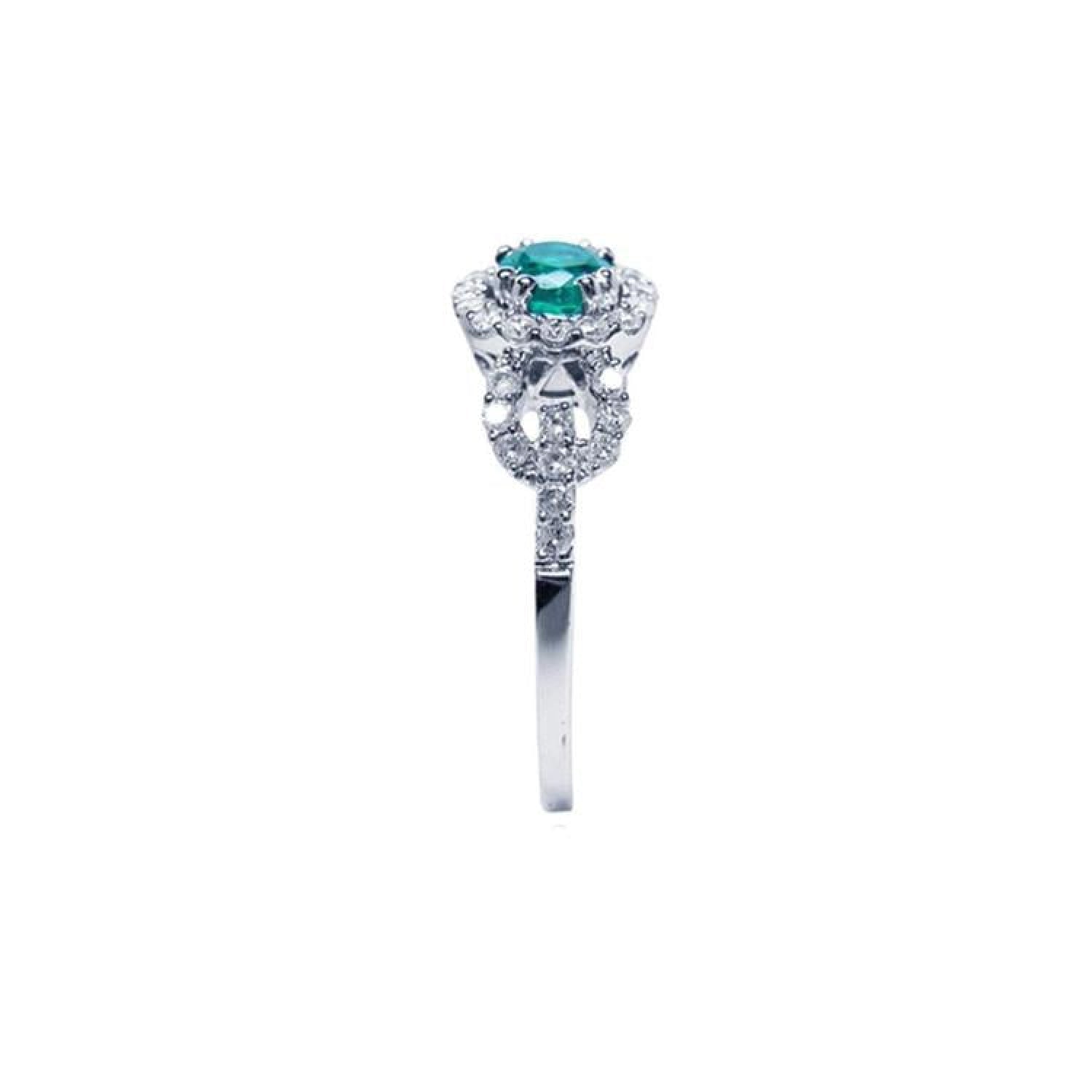 Round emerald halo ring with natural diamonds set in 14K white gold.