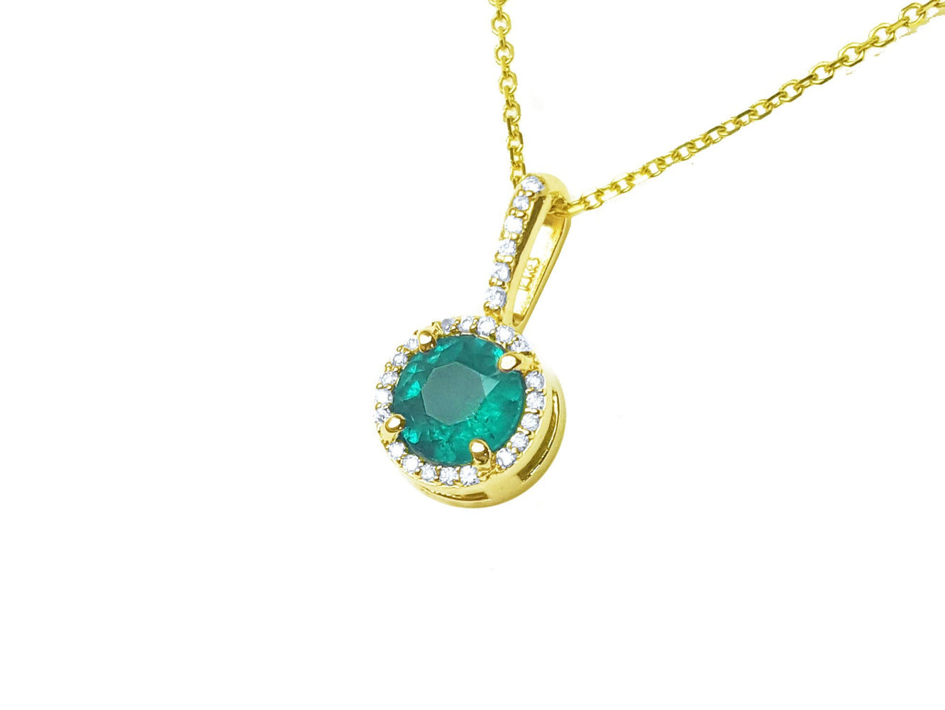 Topside view of a yellow gold emerald pendant necklace side gallery profile visible.