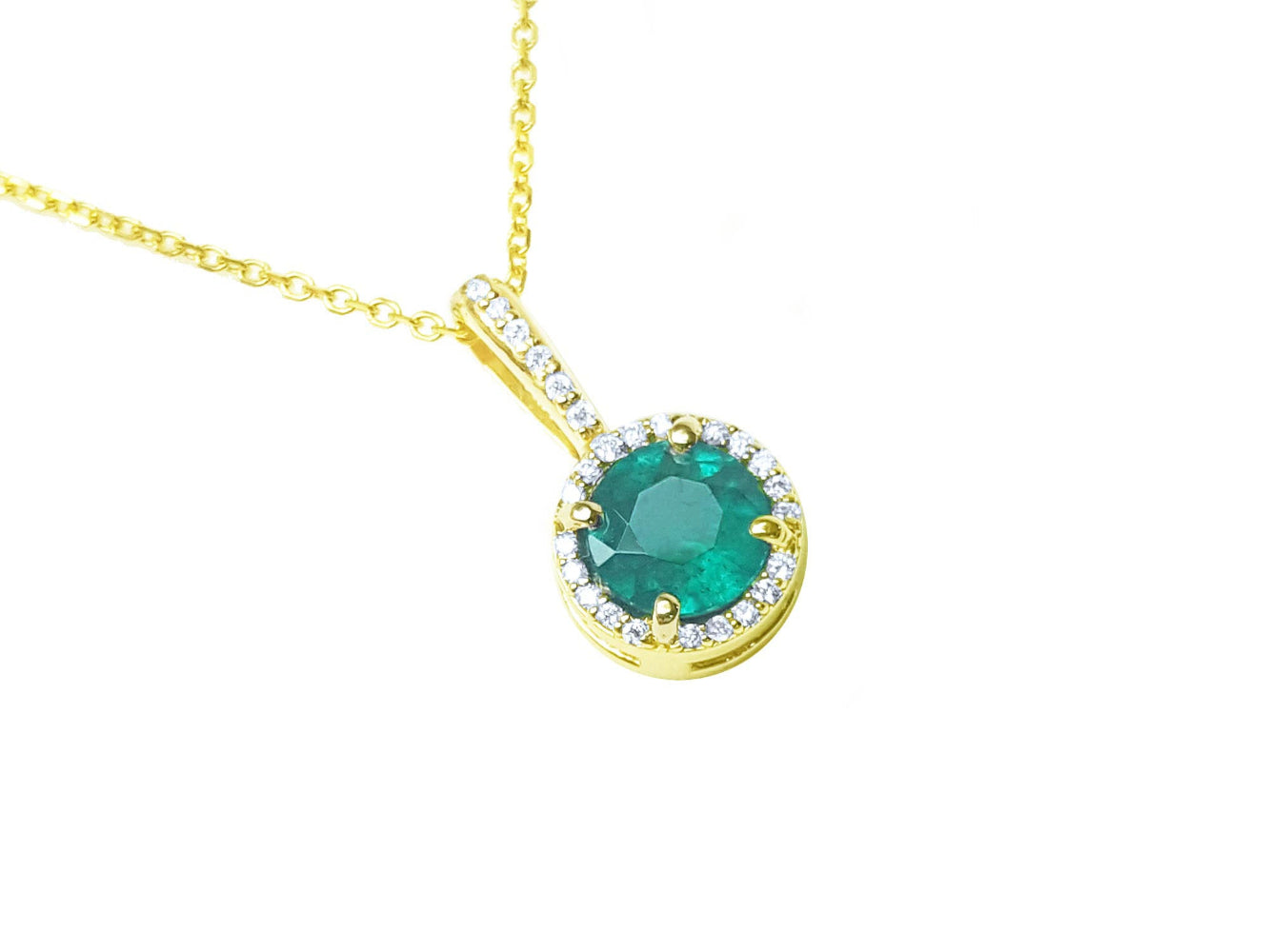 The topside view of a yellow gold natural colombian emerald round cut with halo diamond,