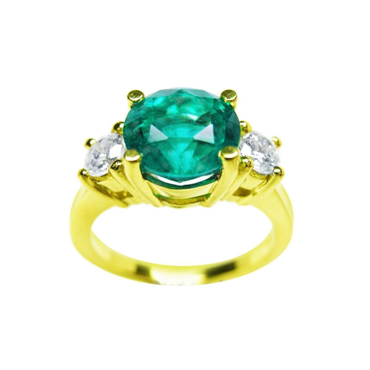 A three stone round cut emerald ring with round side diamonds in 18k yellow gold, on a front position, top view,