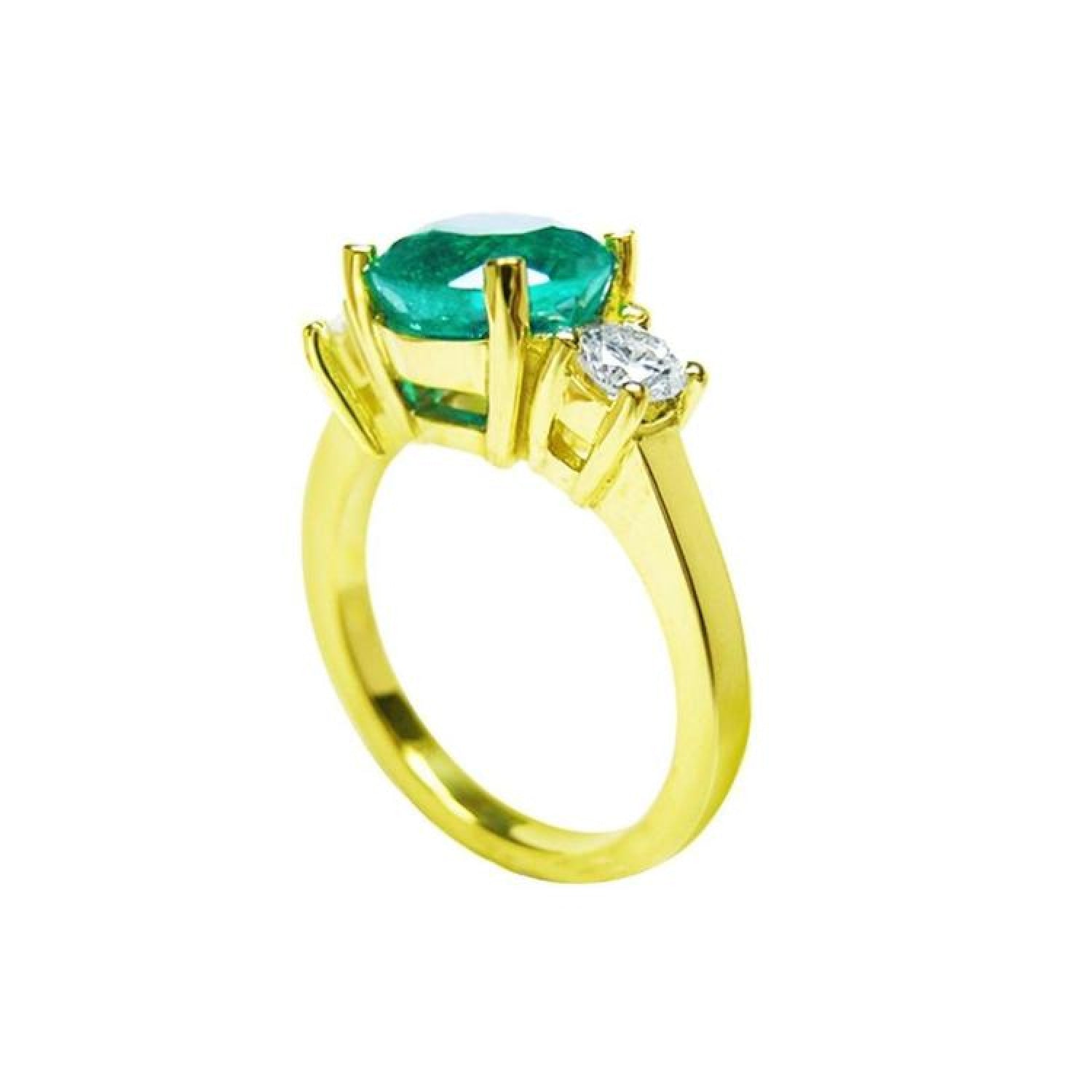 2.44 ct. GIA certified F1 Colombian emerald three-stone ring with round diamonds in 18K yellow gold.