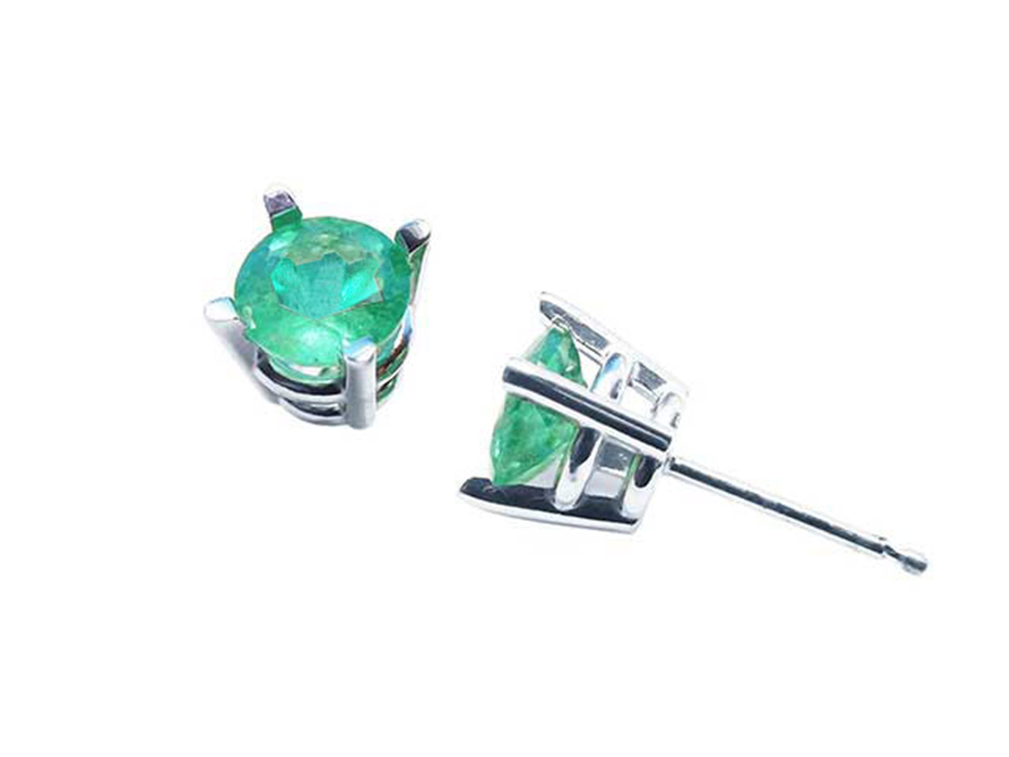 Pair of emerald stud earrings white gold on a top and underside view.