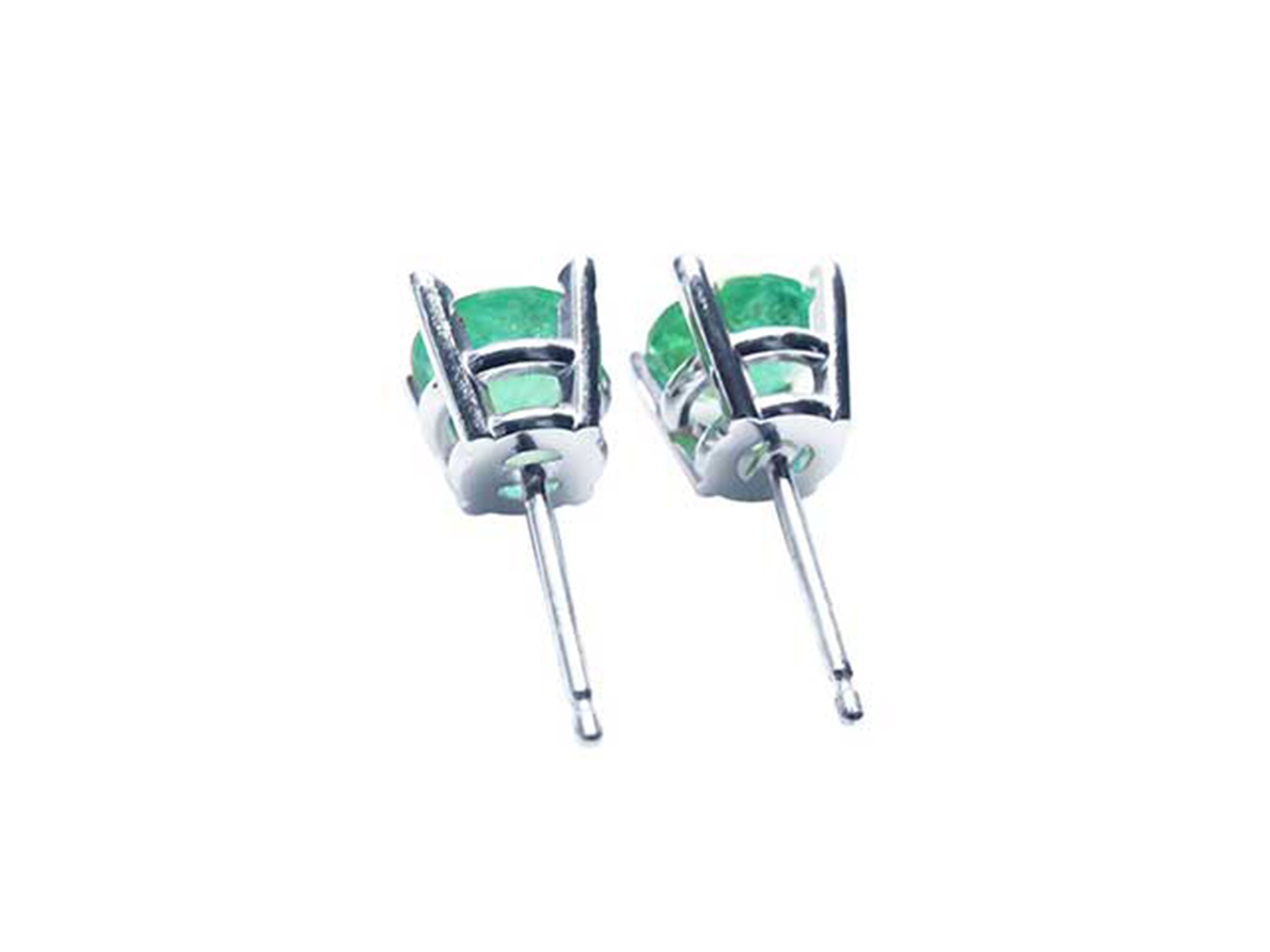 Pair of 14k gold emerald stud earrings in 14k white gold, underside profile view.
