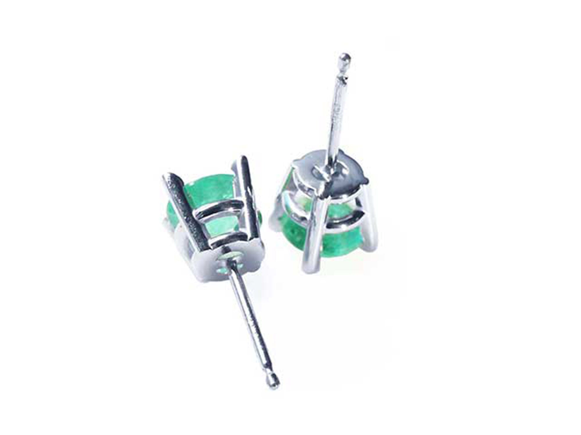 Pair of earrings with round cut colombian emeralds and 14k white gold metalwork on a upside down position.