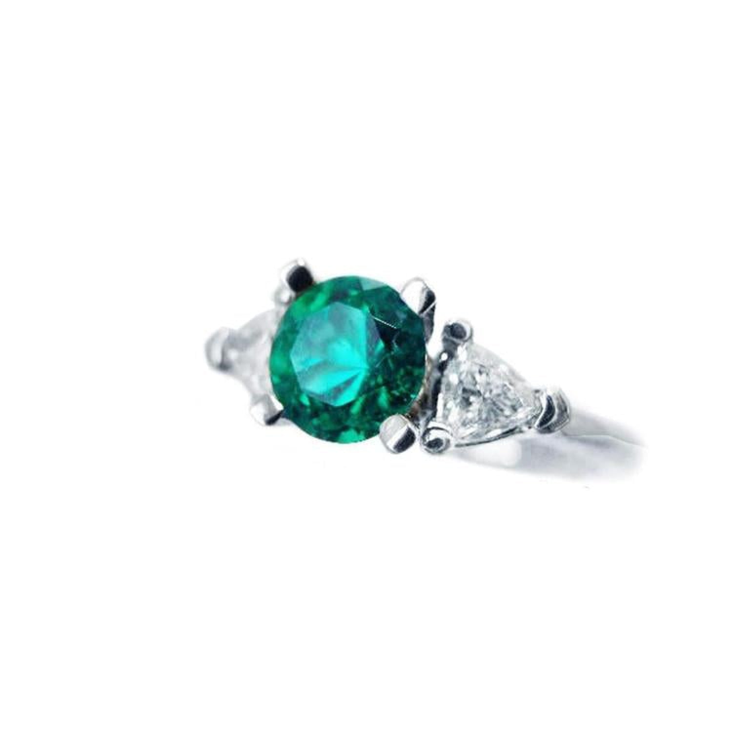 1.00 ct. round emerald ring with trillion side diamonds in 14K white gold.