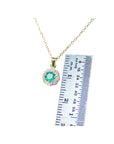 Lady's natural round cut emerald halo diamond minimalist necklace 14K yellow gold