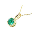 1.80 ct. round natural emerald pendant necklace with halo diamonds in 14K yellow gold.