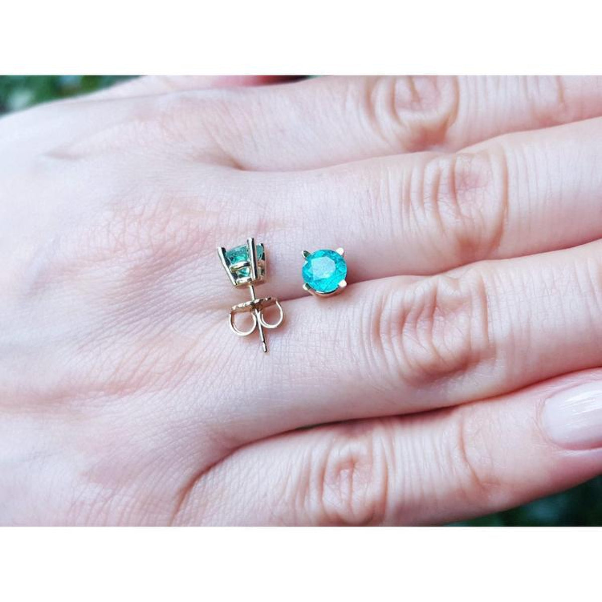 1.09 ct. round natural Colombian emerald stud earrings in 14K gold basket settings with push backs.