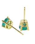 A pair of 14k yellow gold emerald stud earrings round cut, upside down and downside view.