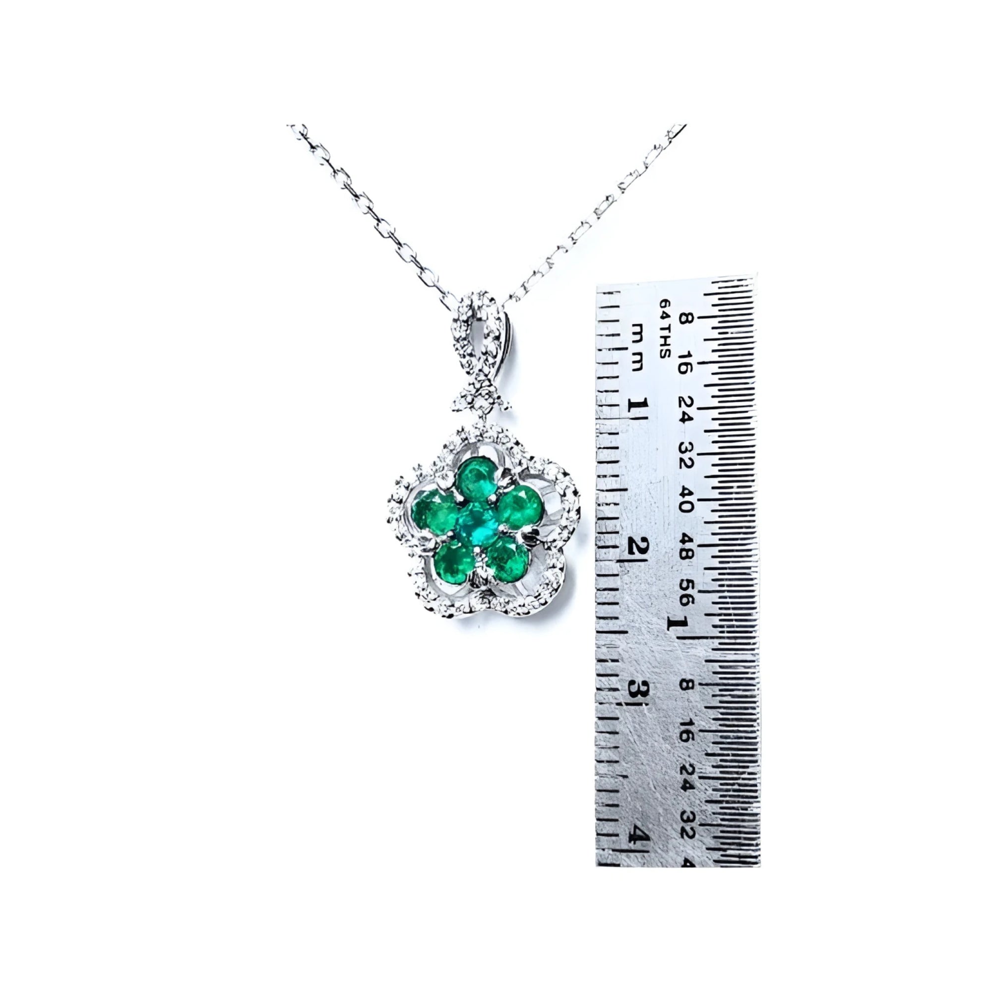 14K white gold emerald and diamond cluster necklace, clover-like five-petal design.
