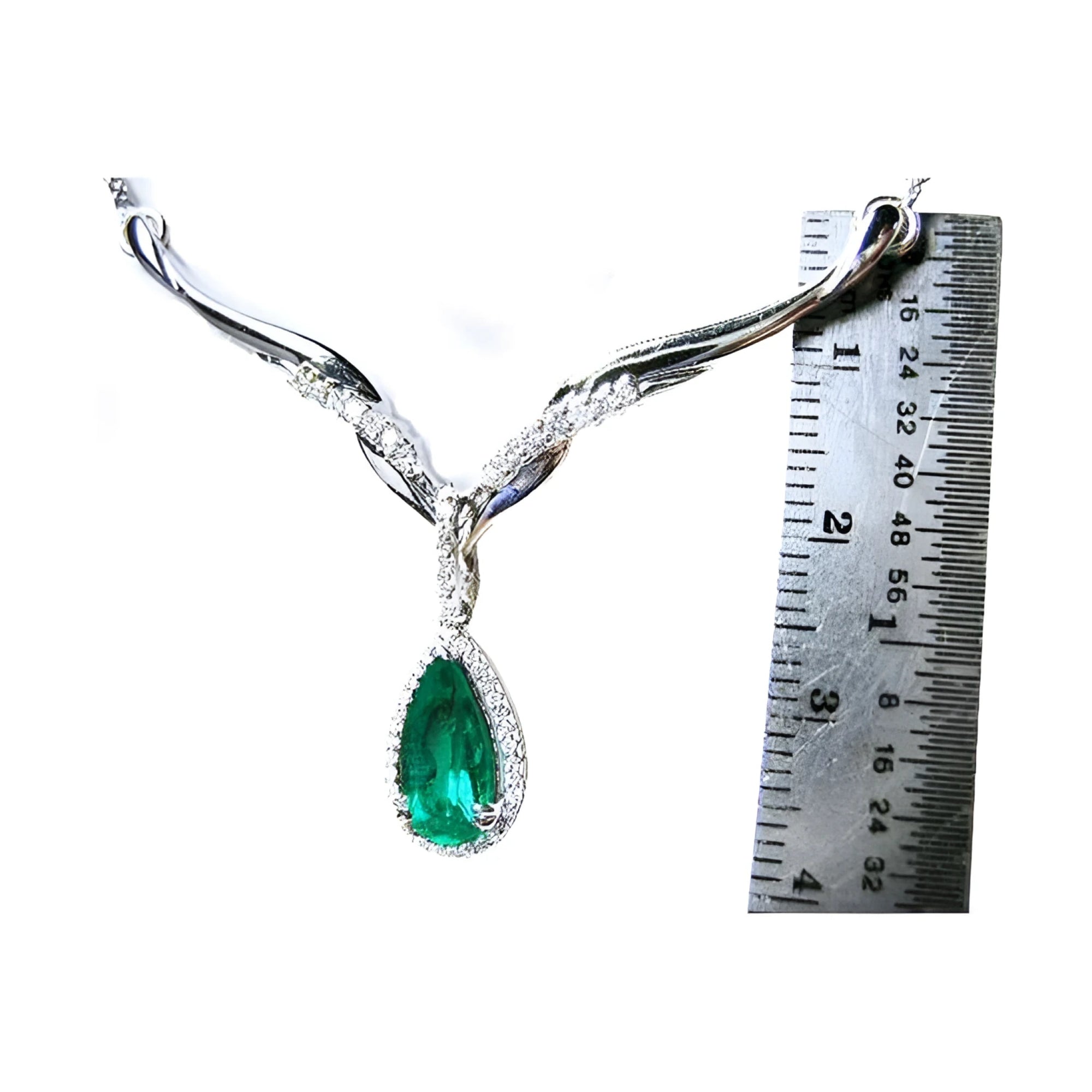 1.28 carat pear cut emerald necklace in 14K white gold with diamond halo and chevron design.