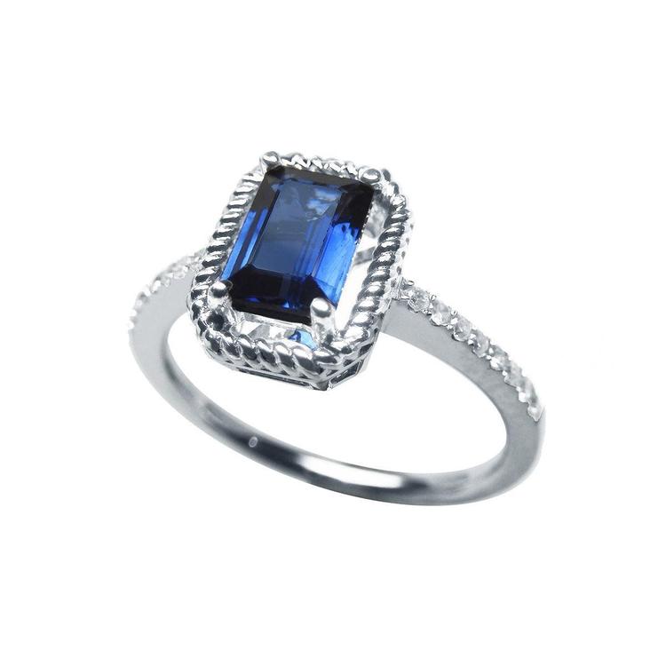 Women's sapphire solitaire ring medium light blue accent diamonds 14K white gold, lateral position half profile view