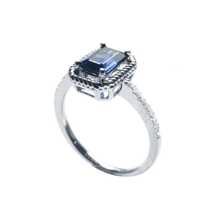 Women's sapphire solitaire ring medium light blue accent diamonds 14K white gold, half side top and shank profile view