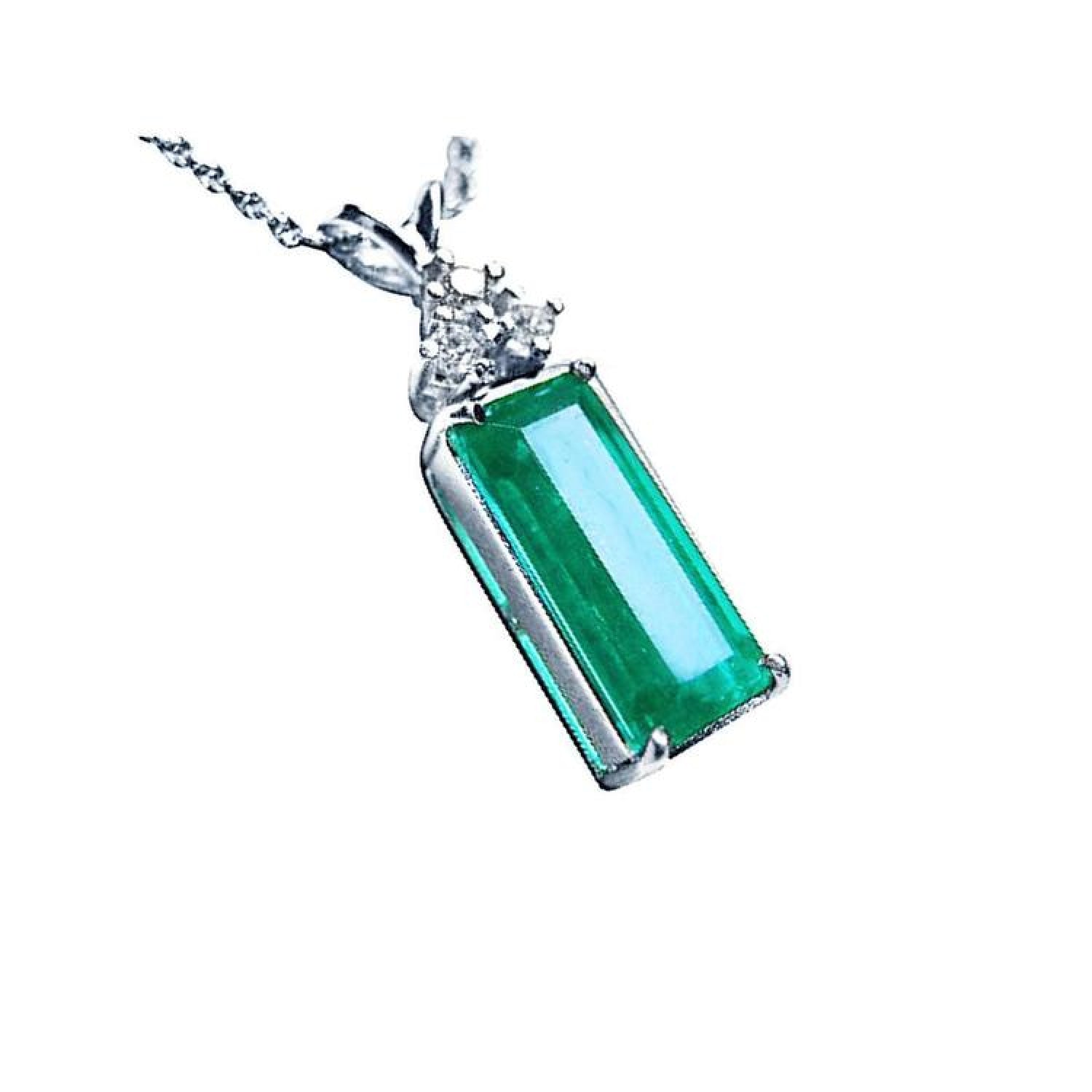 Emerald pendant with a rectangular medium bluish-green emerald and diamond accents in 14K white gold.