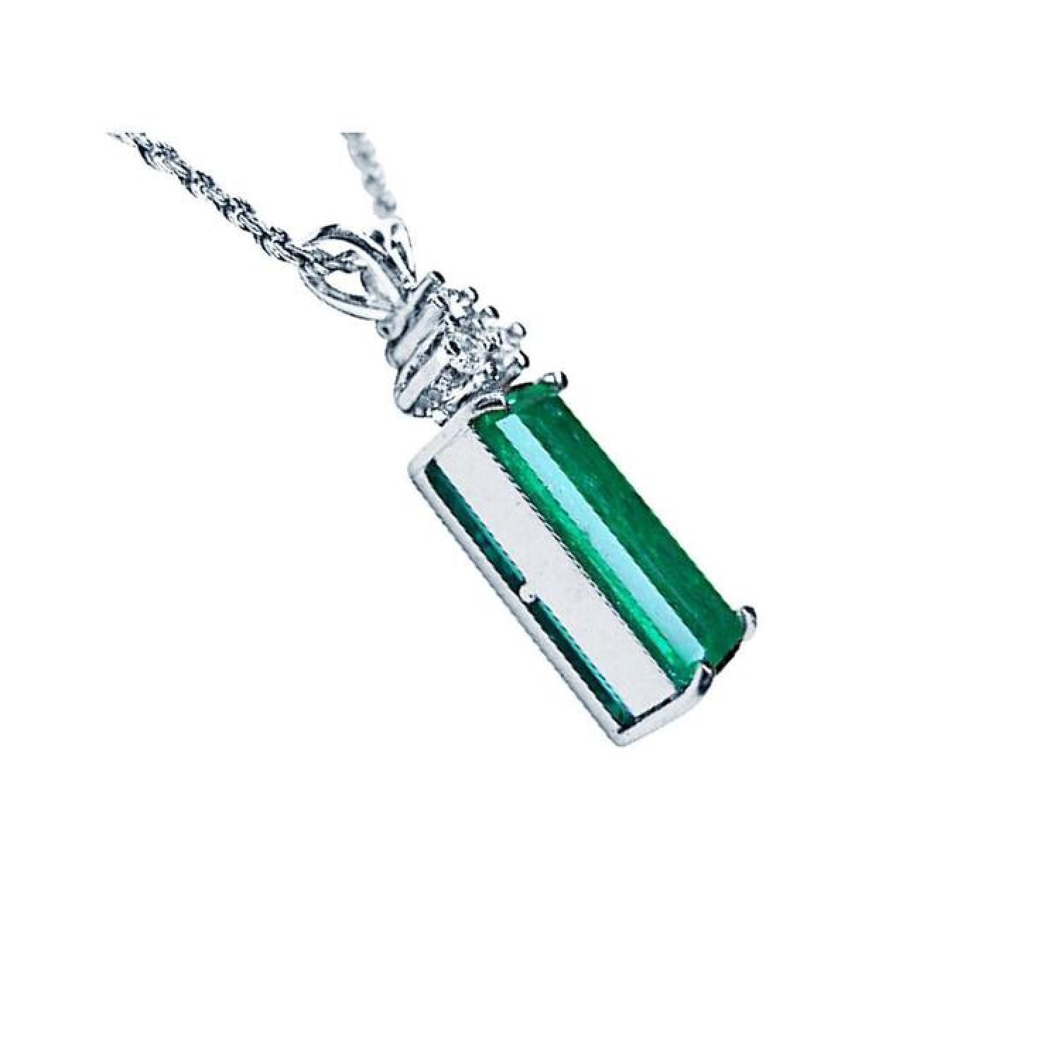 14K white gold pendant with a rectangular medium bluish-green emerald and accent diamonds.