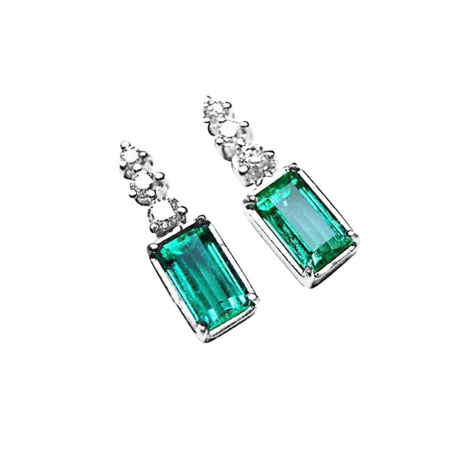 14K white gold dangle earrings with rectangular medium bluish-green emeralds and diamond accents.