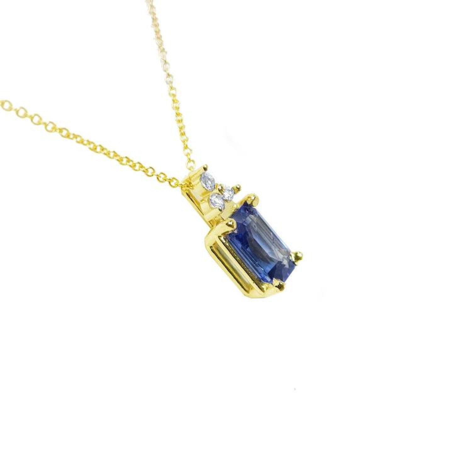 14k gold necklace with a rectangular emerald-cut blue sapphire pendant and three accent diamonds.