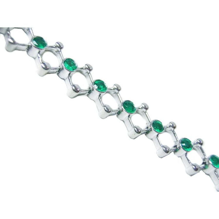 14K white gold bracelet with round Colombian emeralds bezel set in diamond-shaped links.