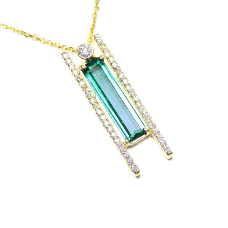 Yellow gold necklace with a natural baguette cut emerald gemstone pendant side natural diamonds.